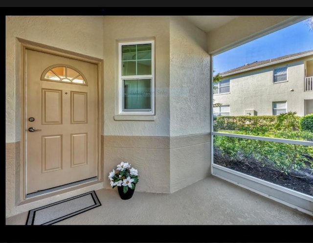 property entrance with a balcony