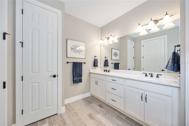 bathroom with vanity and hardwood / wood-style flooring