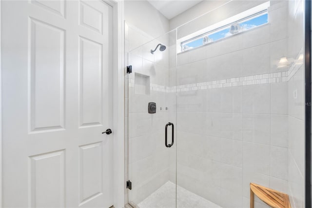 bathroom featuring an enclosed shower