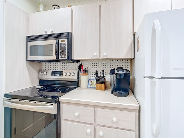 kitchen featuring decorative backsplash and stainless steel appliances