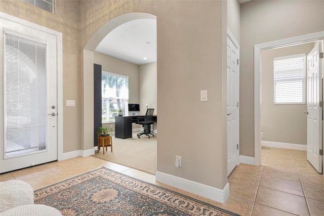 foyer featuring light tile patterned flooring