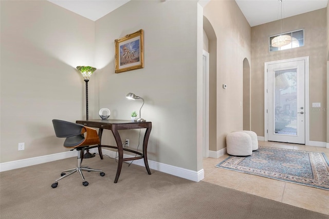 office space with light tile patterned floors