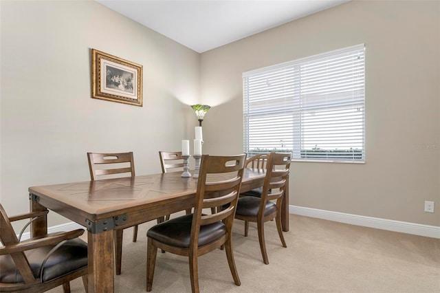 dining space with light carpet