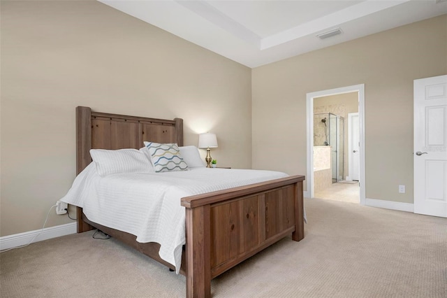 carpeted bedroom featuring connected bathroom