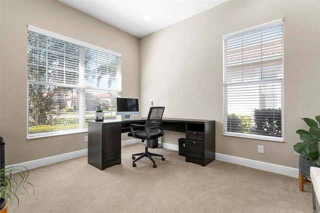 office with light carpet and plenty of natural light