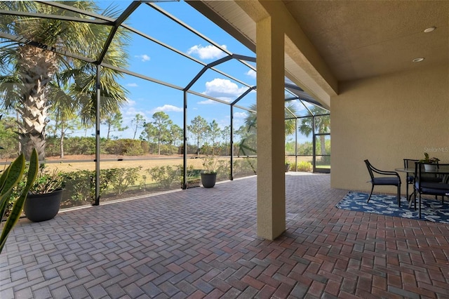 view of patio with a lanai