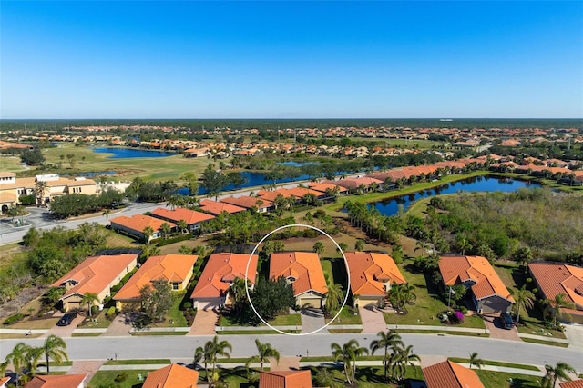 birds eye view of property featuring a water view