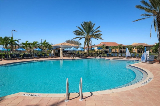 view of swimming pool with a patio area