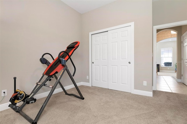 exercise room with light carpet