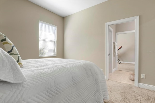 bedroom featuring light colored carpet