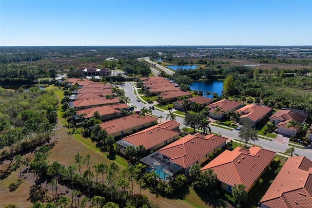 drone / aerial view with a water view