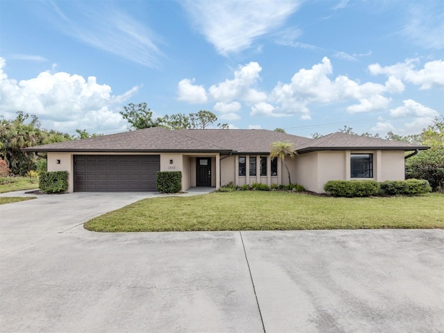 single story home featuring a front yard and a garage