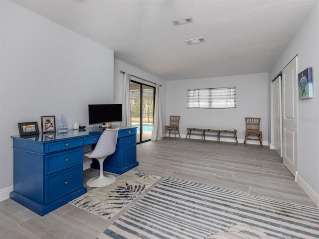 office featuring a textured ceiling