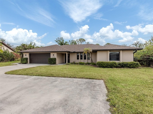 single story home with a front lawn and a garage