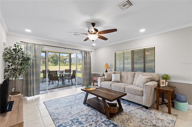 tiled living room with ceiling fan and ornamental molding