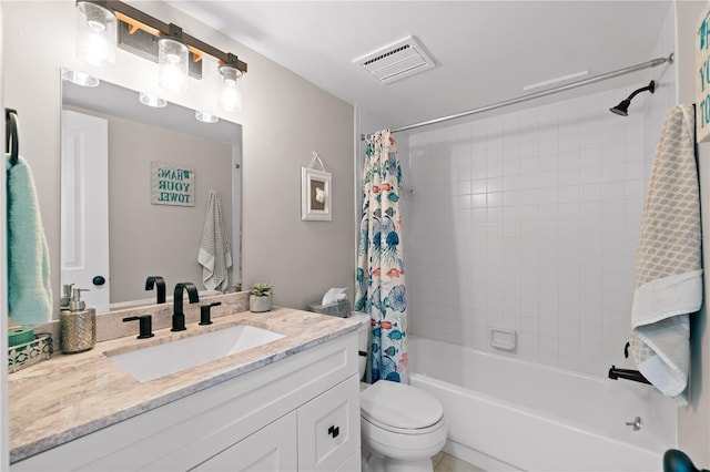 full bathroom featuring shower / tub combo with curtain, vanity, and toilet