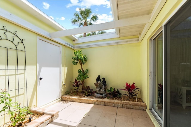 entrance to property featuring a patio area