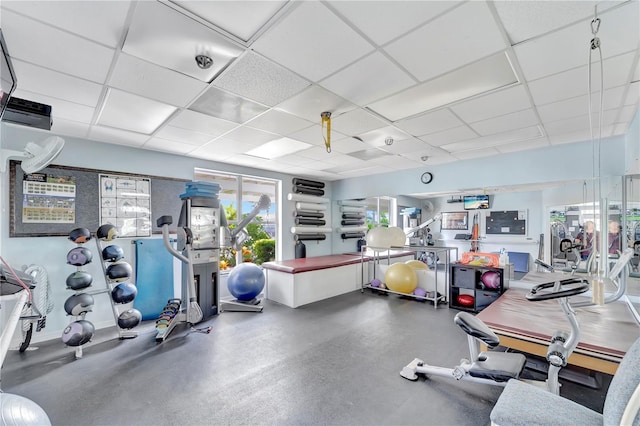 workout area featuring a drop ceiling