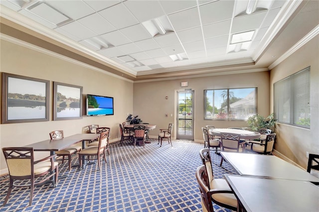 office area featuring a tray ceiling, crown molding, and carpet