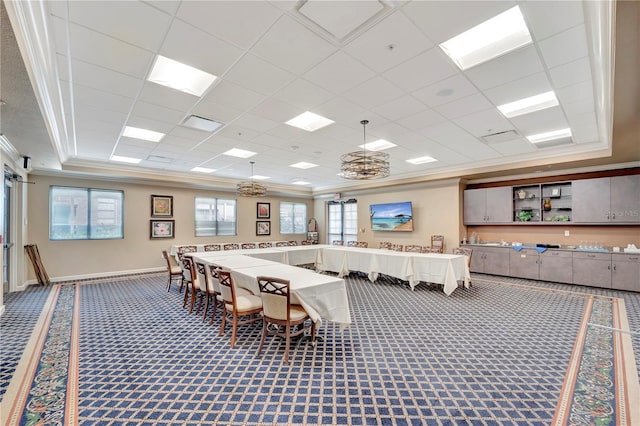 game room featuring carpet flooring, a raised ceiling, and crown molding