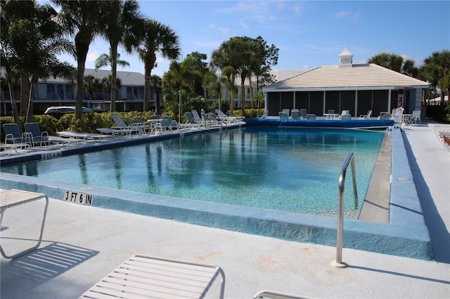 view of swimming pool with a patio