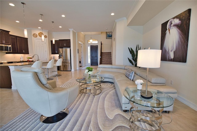 living room featuring light tile patterned floors and ornamental molding