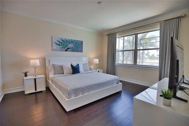 bedroom with dark hardwood / wood-style flooring and ornamental molding