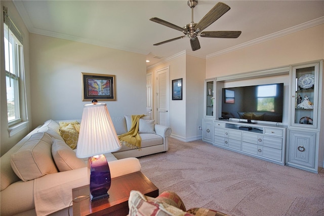 living room with light carpet, ceiling fan, and ornamental molding