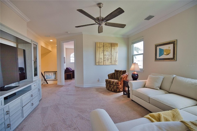 living room with light colored carpet, ceiling fan, and crown molding