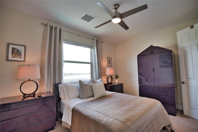 carpeted bedroom with ceiling fan