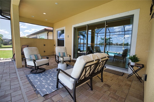 view of patio featuring a lanai and an outdoor hangout area