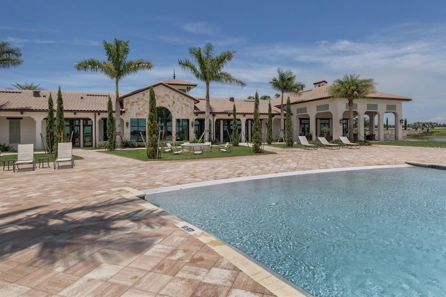 view of swimming pool featuring a patio area