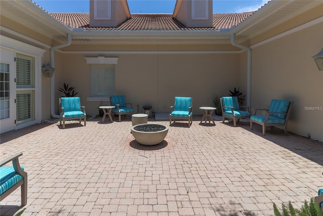 view of patio / terrace featuring a fire pit