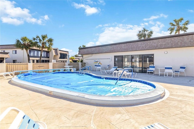 view of swimming pool with a patio