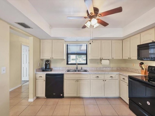 kitchen with ceiling fan, sink, black appliances, and light tile patterned flooring