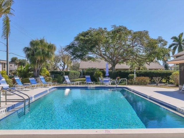 view of swimming pool with a patio