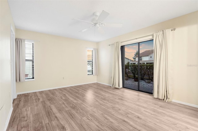 spare room featuring ceiling fan and light hardwood / wood-style flooring