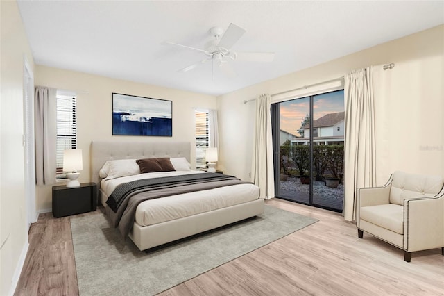 bedroom featuring ceiling fan, access to outside, and light wood-type flooring