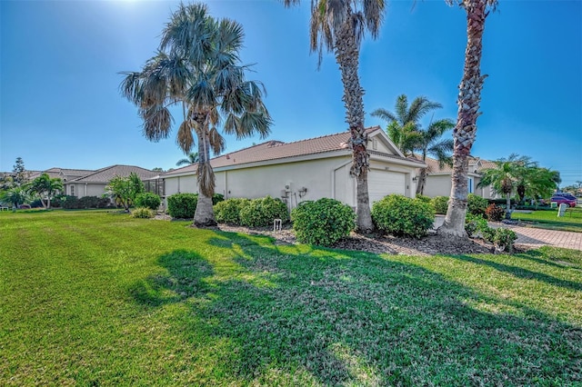 view of side of home with a yard