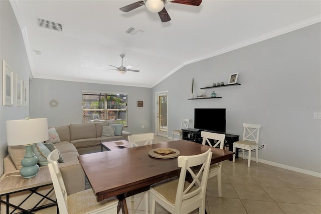 dining area featuring light tile patterned floors, vaulted ceiling, ceiling fan, and crown molding