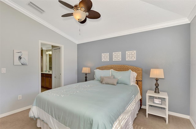 bedroom featuring ceiling fan, ensuite bathroom, crown molding, light colored carpet, and lofted ceiling