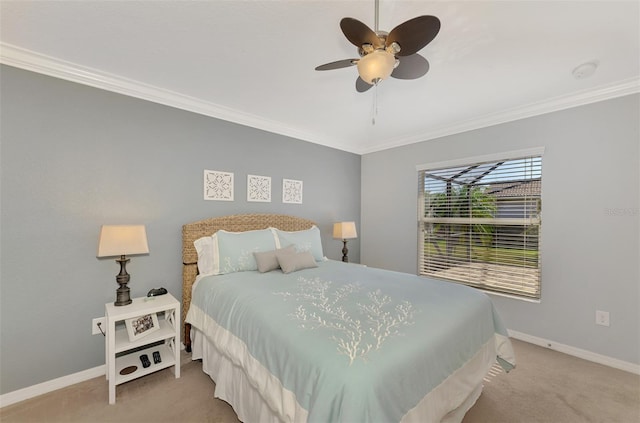 carpeted bedroom with ceiling fan and crown molding