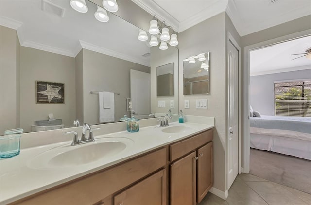 bathroom featuring tile patterned floors, ceiling fan, ornamental molding, and vanity