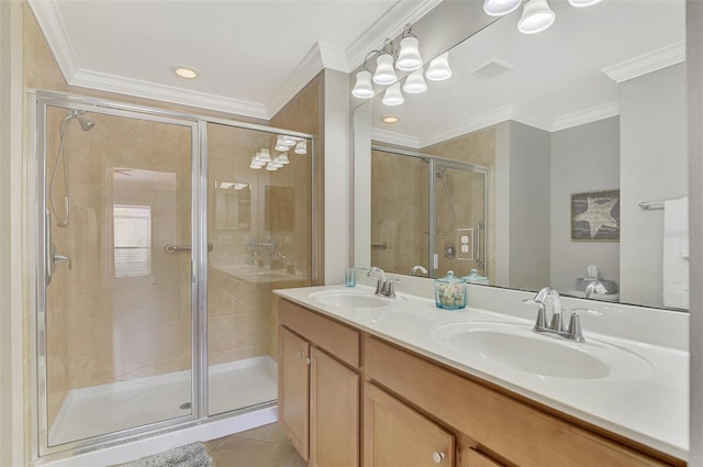 bathroom featuring tile patterned flooring, vanity, a shower with shower door, and ornamental molding