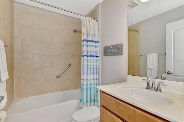 full bathroom featuring vanity, toilet, and shower / bath combo with shower curtain