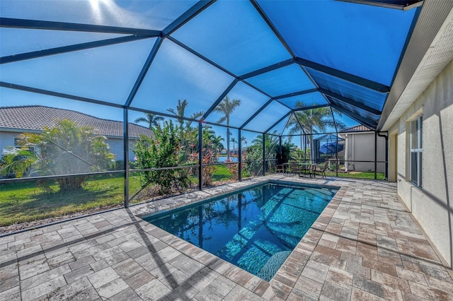 view of pool with a lanai and a patio