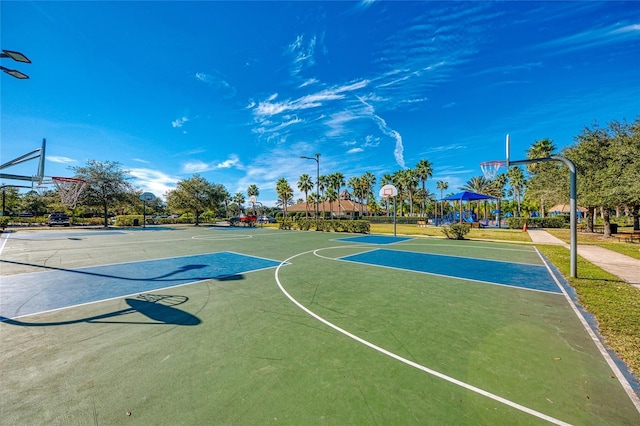 view of sport court with a playground