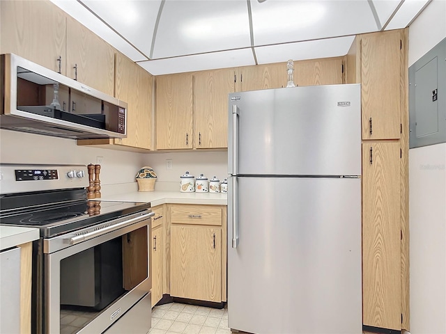 kitchen with electric panel, light brown cabinets, and appliances with stainless steel finishes