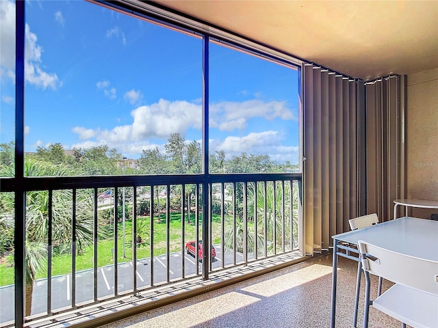 unfurnished sunroom featuring a healthy amount of sunlight