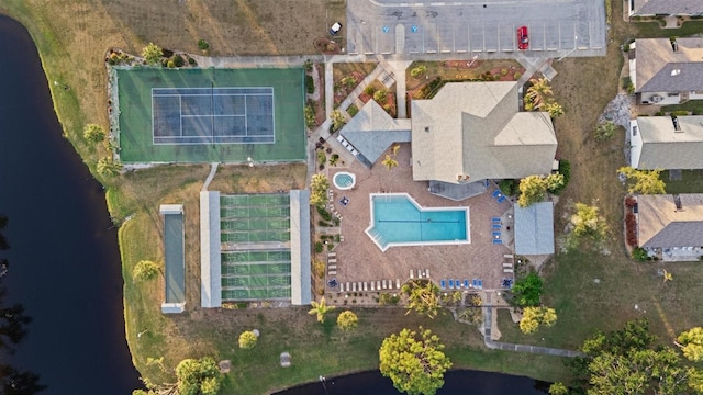 birds eye view of property with a water view